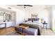 Serene main bedroom featuring a comfortable king bed, a vanity, and plenty of natural light at 10640 E Mercer Ln, Scottsdale, AZ 85259