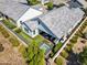 Aerial view of a pristine backyard with a covered outdoor living area, manicured lawn and tiled plunge pool at 11878 N Hershey St, Surprise, AZ 85388