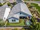 Aerial view of a private backyard oasis with a covered patio, a manicured lawn, and a sparkling plunge pool at 11878 N Hershey St, Surprise, AZ 85388