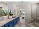 Bright bathroom with double sink vanity, elegant backsplash, and direct access to the bedroom at 11878 N Hershey St, Surprise, AZ 85388