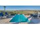 Relaxing community spa pool with comfortable lounge seating and beautiful views of the golf course and mountains at 11878 N Hershey St, Surprise, AZ 85388