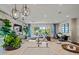 Bright, open floor plan with the kitchen island overlooking the living and dining areas, perfect for entertaining at 11878 N Hershey St, Surprise, AZ 85388