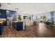 Open-concept living space featuring a modern kitchen, stylish furniture, and bright natural light at 11878 N Hershey St, Surprise, AZ 85388