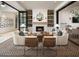 Cozy living room features a stone fireplace, comfortable seating, and stylish decor for relaxed gatherings at 11878 N Hershey St, Surprise, AZ 85388