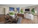 Open living space with a modern kitchen, dining area, and comfortable seating, perfect for entertaining at 11878 N Hershey St, Surprise, AZ 85388