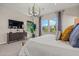 Bright primary bedroom featuring ample natural light from large windows with a lovely view at 11878 N Hershey St, Surprise, AZ 85388