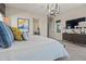 Bedroom suite featuring a view to the attached bathroom and modern decor at 11878 N Hershey St, Surprise, AZ 85388