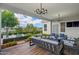 Inviting outdoor patio with comfortable seating, stylish lighting, and landscaped garden views at 11878 N Hershey St, Surprise, AZ 85388