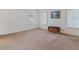 Spacious bedroom with neutral carpet and white walls; plantation shutters on the windows at 12001 N 53Rd Ave, Glendale, AZ 85304