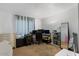 Bedroom setup as a home office with desk, chair, and ample storage solutions at 12001 N 53Rd Ave, Glendale, AZ 85304