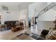 Bright living room with tile flooring, staircase, and a comfortable seating area at 12001 N 53Rd Ave, Glendale, AZ 85304