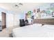 Inviting bedroom featuring blue walls, a comfortable bed, and a functional workspace, perfect for study or relaxation at 1401 E Brentrup Dr, Tempe, AZ 85283