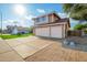 Charming two-story home with a well-manicured lawn, and an attached three car garage at 1401 E Brentrup Dr, Tempe, AZ 85283