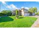 Charming two-story home with a well-manicured lawn, and an attached three car garage at 1401 E Brentrup Dr, Tempe, AZ 85283