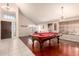 Game room with a billiard table, hardwood floors, neutral walls, and bright natural light at 1401 E Brentrup Dr, Tempe, AZ 85283