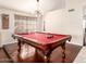 Game room with a billiard table, hardwood floors, neutral walls, and bright natural light at 1401 E Brentrup Dr, Tempe, AZ 85283