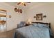 Comfortable bedroom with a ceiling fan, and a connecting living space at 144 W Bahamas Dr, Casa Grande, AZ 85122