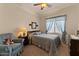 Cozy bedroom with a comfortable bed, ceiling fan, and ample natural light at 144 W Bahamas Dr, Casa Grande, AZ 85122
