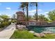 Inviting community entrance with stone signage, well-manicured greenery, and calming water features for a warm welcome at 144 W Bahamas Dr, Casa Grande, AZ 85122