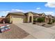 Well-maintained home with a spacious driveway and manicured front yard at 144 W Bahamas Dr, Casa Grande, AZ 85122