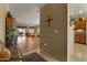 Inviting hallway leading to a spacious living area, highlighting open-concept design and warm natural light at 144 W Bahamas Dr, Casa Grande, AZ 85122