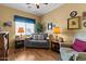 Inviting living room with comfortable seating and lots of natural light at 144 W Bahamas Dr, Casa Grande, AZ 85122