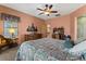 Comfortable main bedroom with wood dresser and an ensuite bathroom at 144 W Bahamas Dr, Casa Grande, AZ 85122