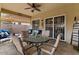 Cozy patio area with ceiling fan, perfect for outdoor dining and relaxation at 144 W Bahamas Dr, Casa Grande, AZ 85122