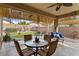 Inviting patio with comfortable seating, ceiling fan, and shade at 144 W Bahamas Dr, Casa Grande, AZ 85122