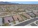 An aerial view displays residences in a desert community with meticulous landscaping at 14939 S 185Th Ave, Goodyear, AZ 85338