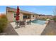 Inviting backyard patio with comfortable seating and view of the sparkling pool at 14939 S 185Th Ave, Goodyear, AZ 85338