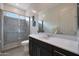 Modern bathroom featuring a glass-enclosed shower, sleek vanity, and stylish fixtures at 14939 S 185Th Ave, Goodyear, AZ 85338