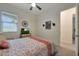Bright bedroom with a cozy bed, neutral walls, and natural light from the window at 14939 S 185Th Ave, Goodyear, AZ 85338