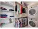 Spacious walk-in closet with custom shelving and storage, plus a washer and dryer at 14939 S 185Th Ave, Goodyear, AZ 85338
