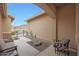 Inviting front courtyard with stylish outdoor seating and desert landscaping at 14939 S 185Th Ave, Goodyear, AZ 85338