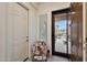 Inviting entryway featuring a stylish chair and a modern door, showcasing the home's blend of comfort and contemporary design at 14939 S 185Th Ave, Goodyear, AZ 85338
