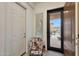 Inviting entryway featuring a stylish chair and a modern door, showcasing the home's blend of comfort and contemporary design at 14939 S 185Th Ave, Goodyear, AZ 85338