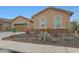 A well-maintained home featuring manicured desert landscaping, a two-car garage, and charming curb appeal at 14939 S 185Th Ave, Goodyear, AZ 85338