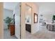 Hallway view showing access to the Primary bathroom, living room, and bedroom at 14939 S 185Th Ave, Goodyear, AZ 85338