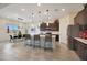 Open kitchen featuring an island with seating and stainless appliances, perfect for cooking and entertaining in style at 14939 S 185Th Ave, Goodyear, AZ 85338