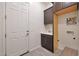 Functional laundry room with ample cabinet space and a utility sink at 14939 S 185Th Ave, Goodyear, AZ 85338