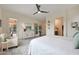 Spacious main bedroom showcasing neutral tones, ceiling fan, and refined decor, creating a cozy and inviting space at 14939 S 185Th Ave, Goodyear, AZ 85338