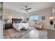 Tranquil main bedroom with ceiling fan, stylish furnishings, and picturesque views, creating a serene retreat at 14939 S 185Th Ave, Goodyear, AZ 85338