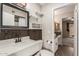 Well-lit bathroom with modern fixtures and wood-like plank flooring at 1545 E Sahuaro Dr # 12, Phoenix, AZ 85020