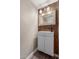 Updated half bathroom with tiled accent wall, modern sink and vanity at 1545 E Sahuaro Dr # 12, Phoenix, AZ 85020