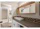 Modern bathroom featuring stylish countertop with vessel sink and decorative backsplash at 1545 E Sahuaro Dr # 12, Phoenix, AZ 85020