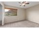 Bright bedroom with a large window offering views of the mountain landscape at 1545 E Sahuaro Dr # 12, Phoenix, AZ 85020