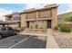 Inviting exterior view of townhome featuring a carport, desert landscaping and private balconies with iron railings at 1545 E Sahuaro Dr # 12, Phoenix, AZ 85020