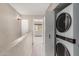 Upstairs hallway with stacked washer/dryer and mountain views at 1545 E Sahuaro Dr # 12, Phoenix, AZ 85020