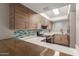 Updated kitchen featuring stylish cabinets, stainless steel appliances, white countertops and backsplash at 1545 E Sahuaro Dr # 12, Phoenix, AZ 85020